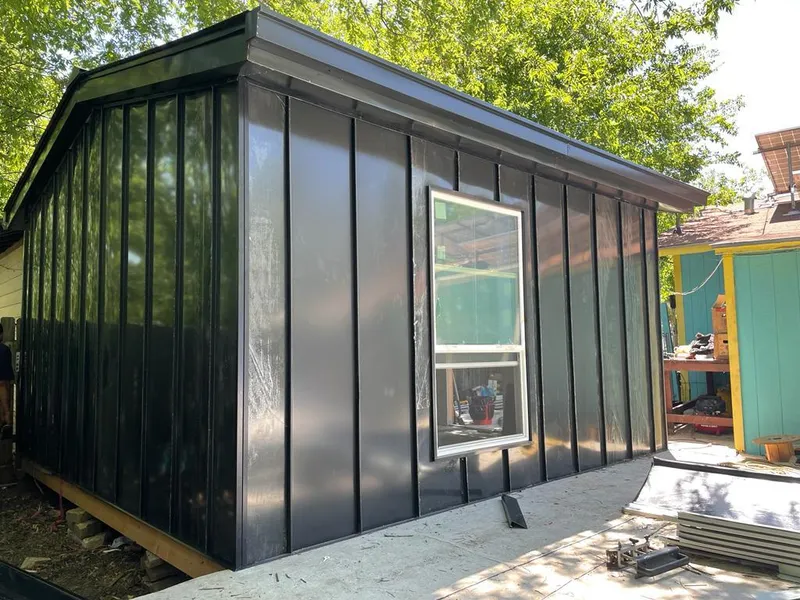 Black standing seam metal wall panels for Roof Inspection in Kaysville